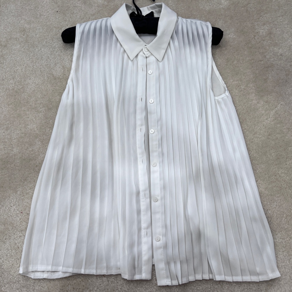 White pleated blouse